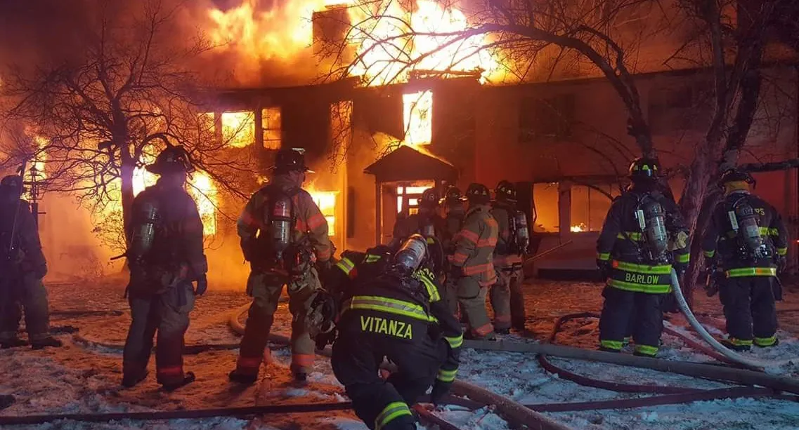 Firefighters batling a fire of a building